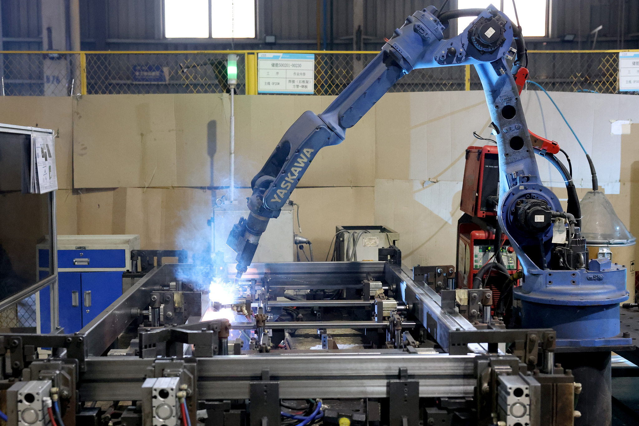 Robots welding new energy vehicle battery pack accessories at a workshop in south China's Fujian Province, July 17, 2024. /CFP