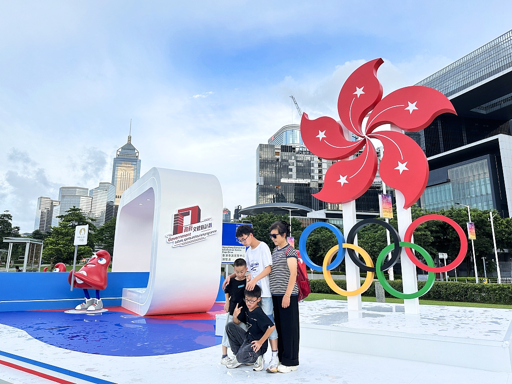 Local Hong Kong residents pose for photos with these Olympic-themed installations at Tamar Park in Admiralty, Hong Kong, on July 19, 2024. /CFP
