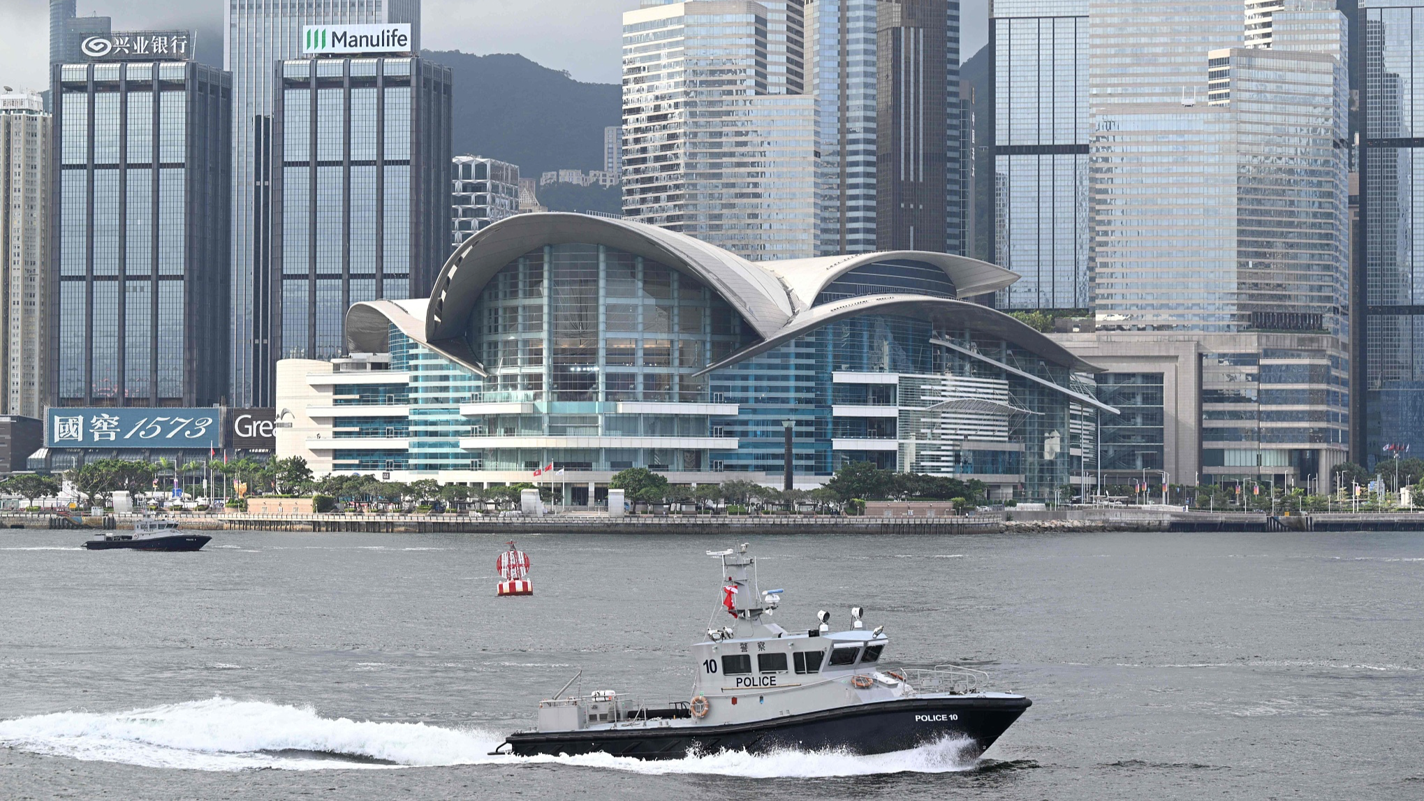 Police boats pass by Hong Kong's Victoria Harbour as the city marks the 27th anniversary of the handover of Hong Kong from Britain to China on July 1, 2024. Photo by Peter PARKS/CFP