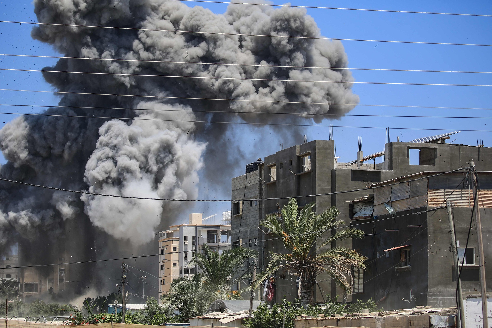 Smoke rises from a building hit by an Israeli strike in Nuseirat in the central Gaza Strip, July 20, 2024. /CFP