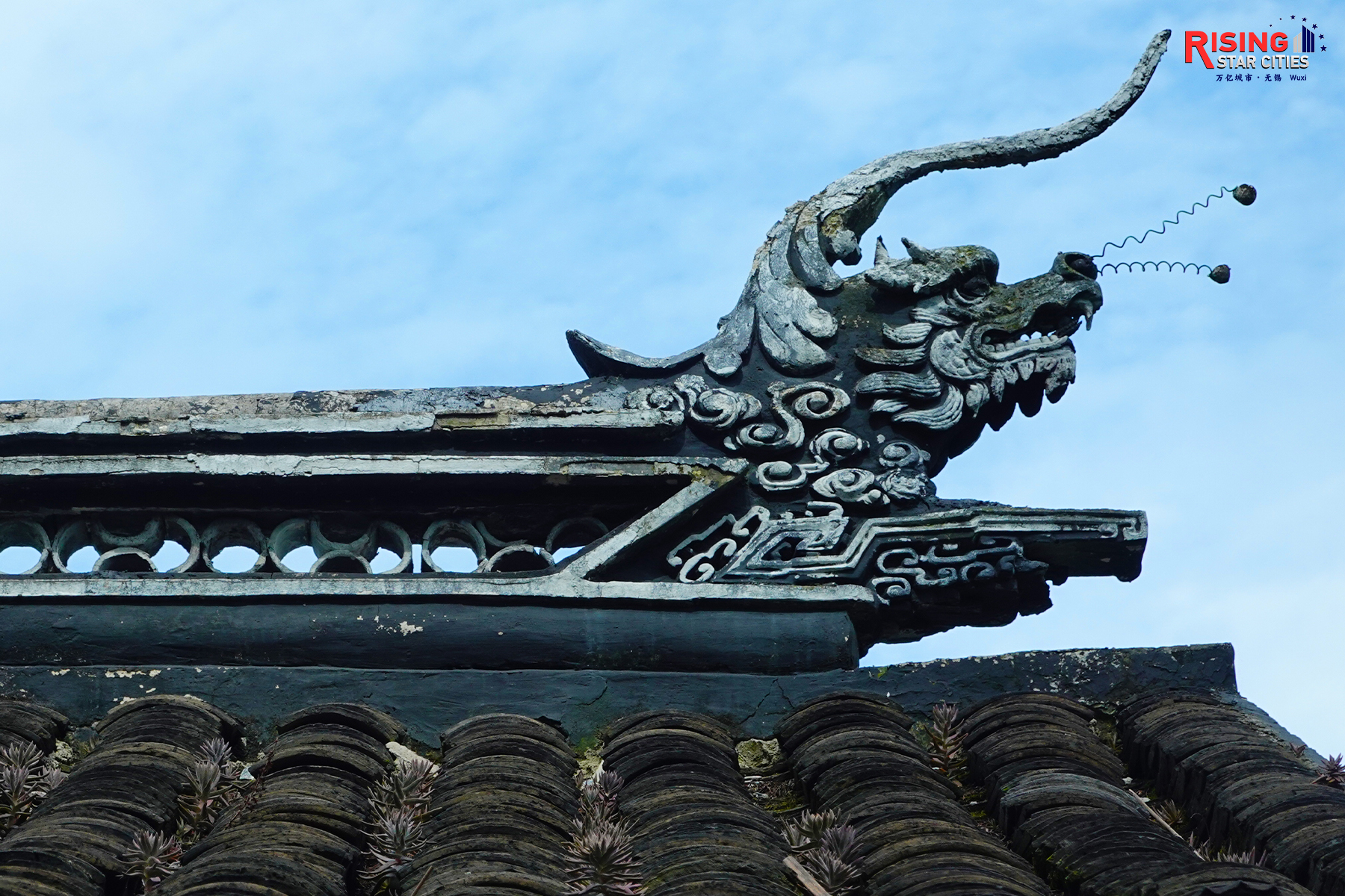 A photo taken on July 20, 2024 shows a preserved roof in Huishan Ancient Town in Wuxi, Jiangsu Province. Dragon heads are common ornamental motifs on roofs in Chinese architecture, where they are believed to ward off evil spirits. /CGTN