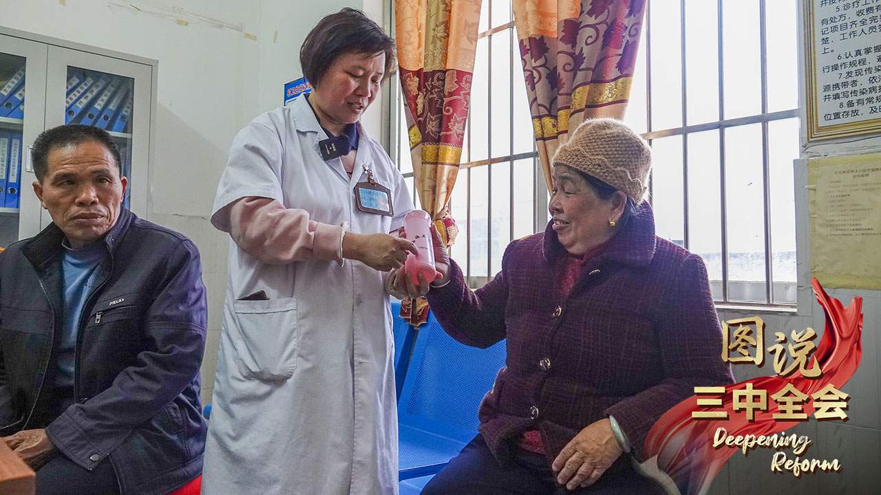 A doctor helps villagers in Hechi City, south China's Guangxi Zhuang Autonomous Region, March 22, 2024. /CFP