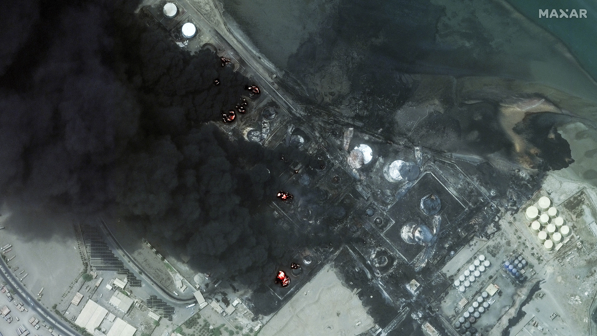 This satellite image provided by Technologies shows a close view of burning oil tanks in Hodeidah, Yemen, July 21, 2024. /CFP