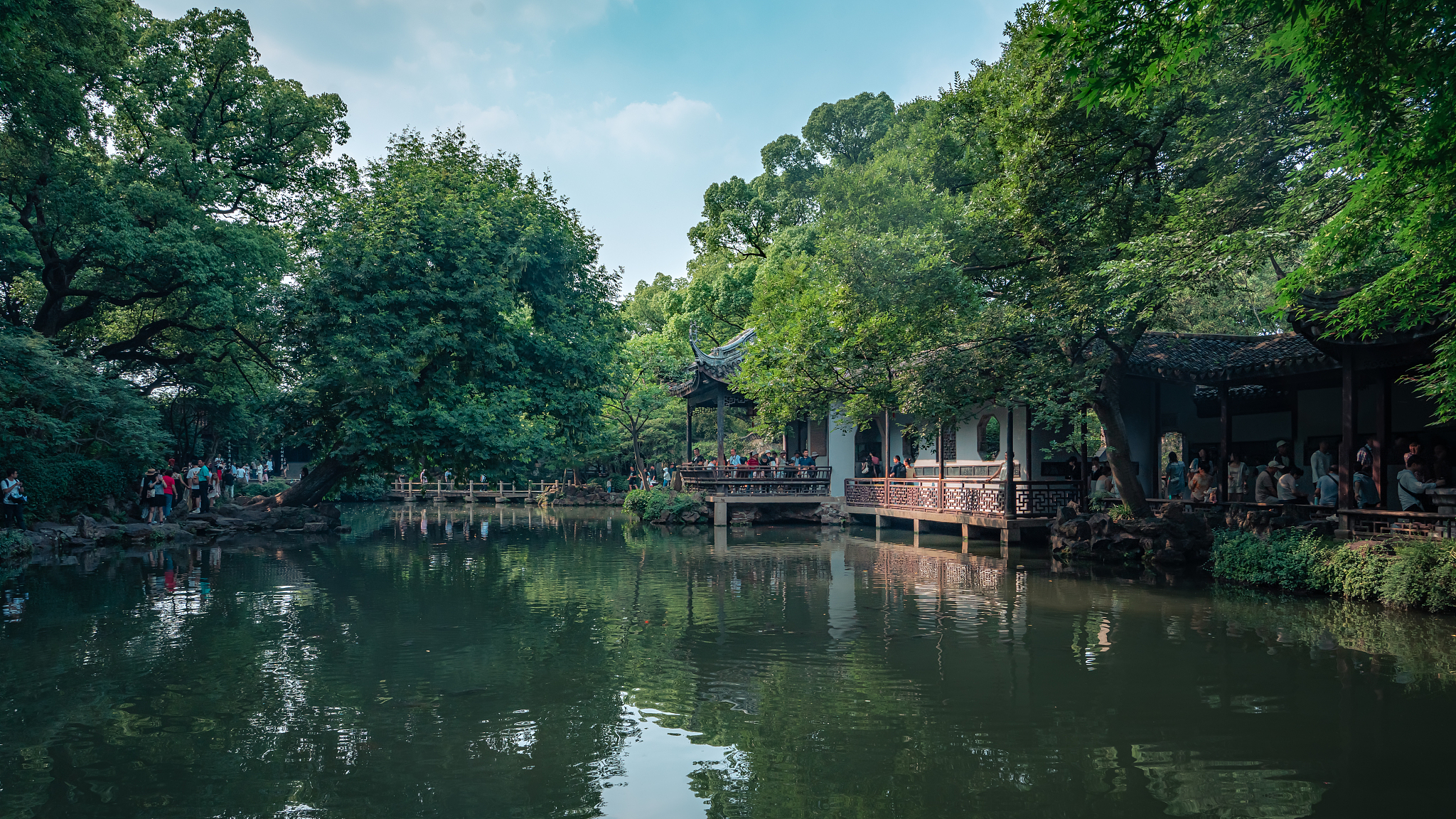 Visitors walking through a classical Chinese garden in Wuxi, east China's Jiangsu Province. /CFP