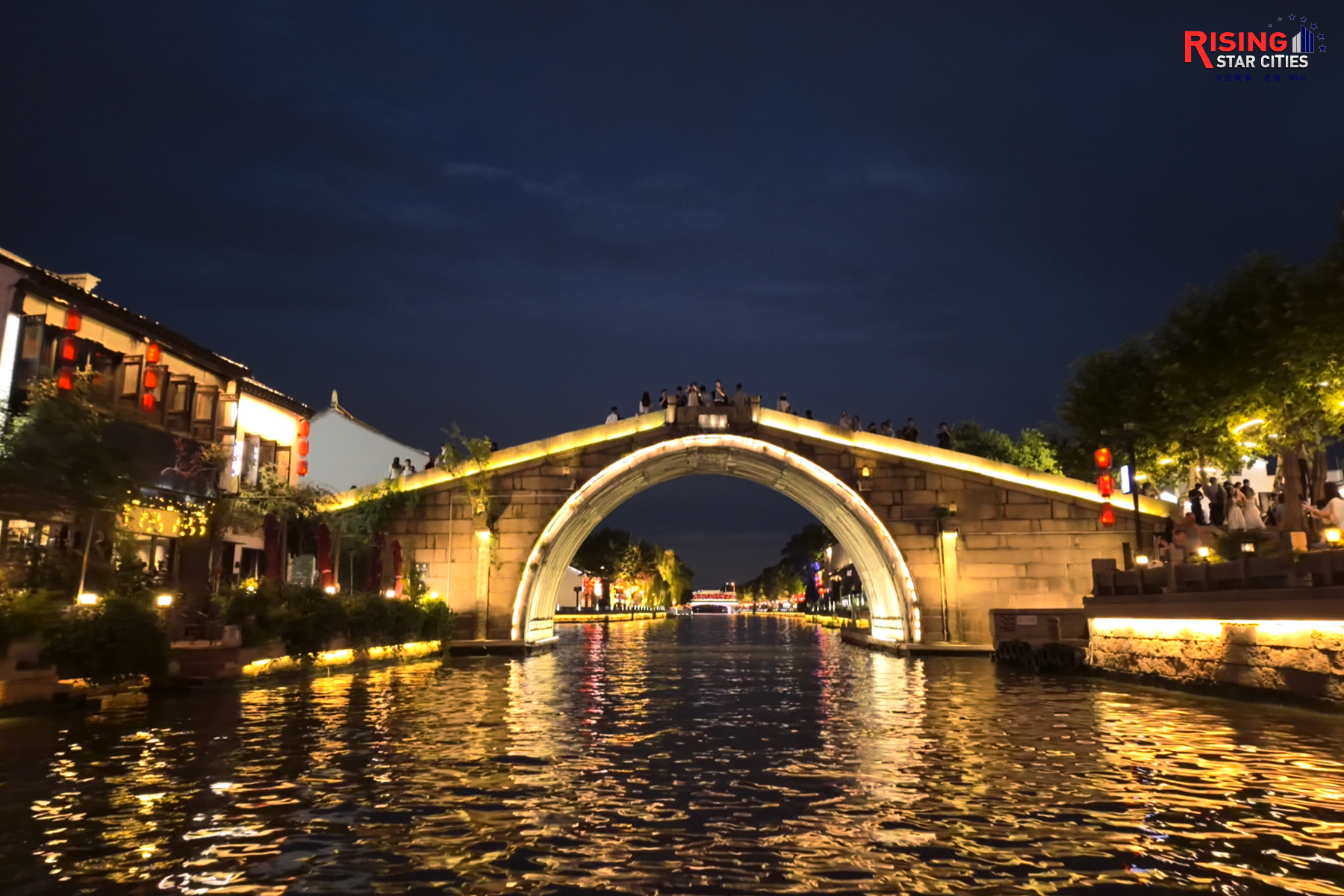 A photo taken on July 21, 2024 shows the Qingming Bridge lit up at night in Wuxi, Jiangsu Province. /CGTN