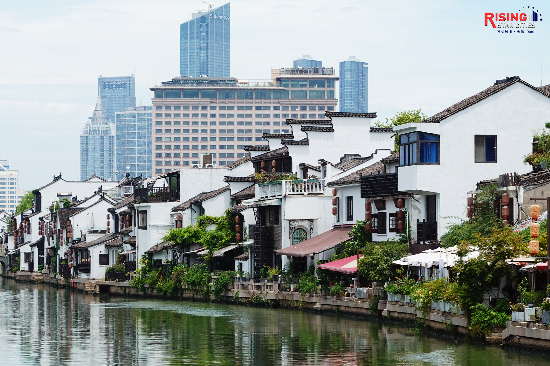 A photo taken on July 21, 2024 shows the traditional Chinese architecture lining the waterway near Qingming Bridge in Wuxi, Jiangsu Province. /CGTN