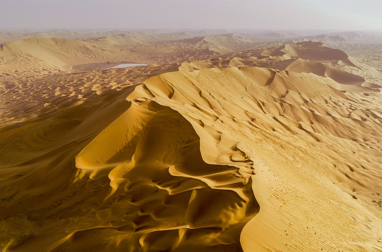 An aerial view of the world's tallest stationary sand dune, Bilutu, in the Badain Jaran Desert in Alxa League, north China's Inner Mongolia Autonomous Region. /IC
