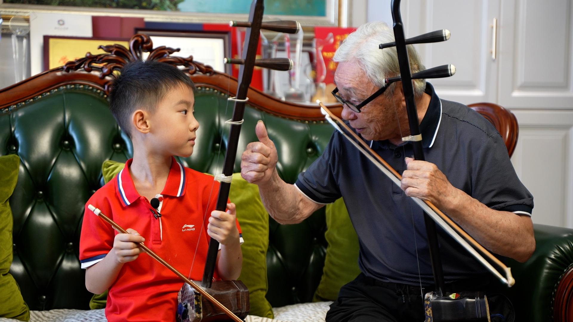 A photo taken on July 22, 2024 shows four generations of the Qian family in Wuxi's Meicun in Jiangsu Province sharing their love of playing the erhu. /CGTN