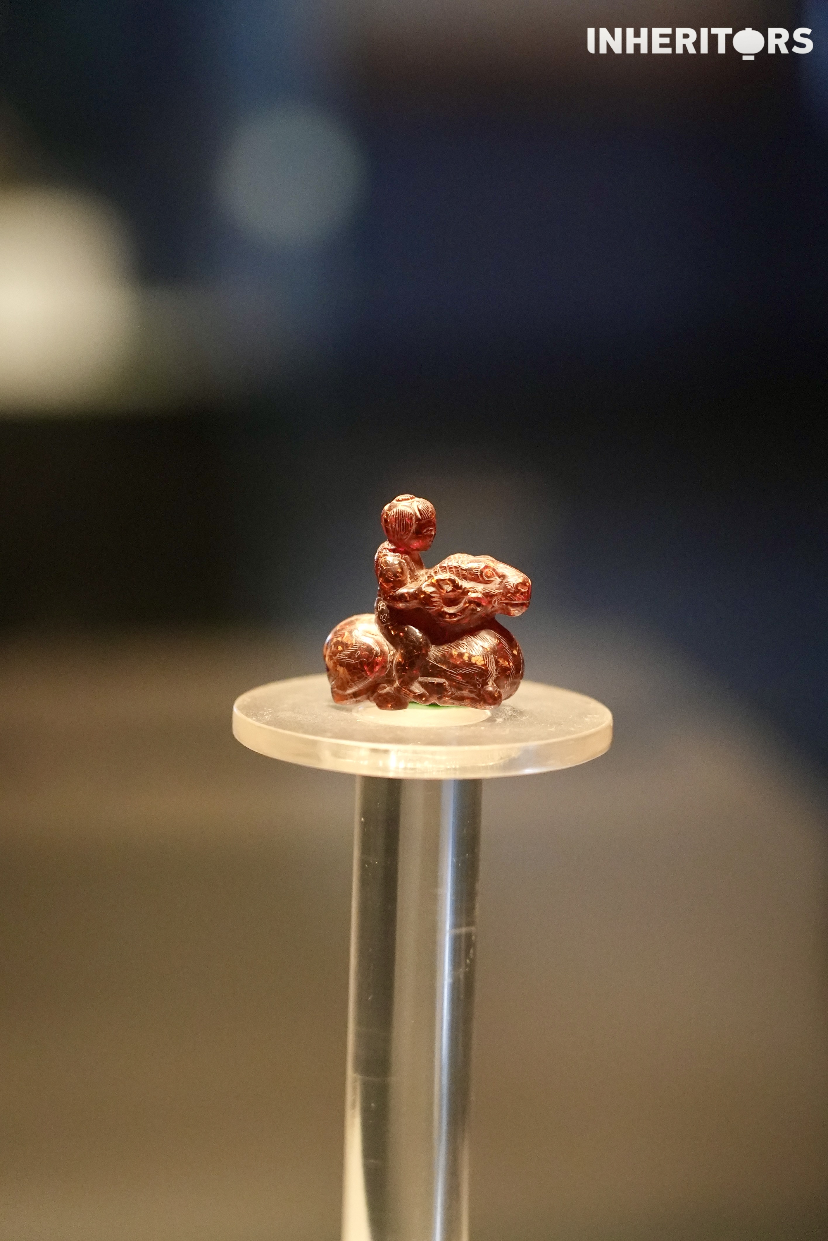 A view of the Cao Wei blood amber figure riding a ram at the Luoyang Museum in Henan Province. /CGTN