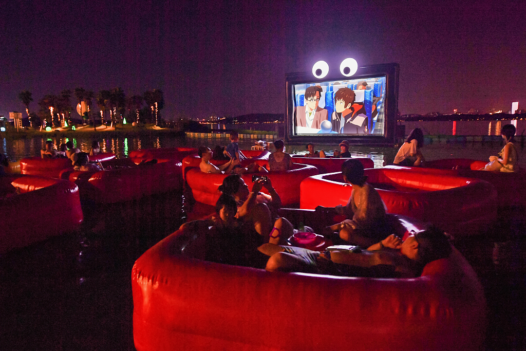 People enjoy a film in the floating movie theater at Donghu Beach in Wuhan, Hubei Province on July 22, 2024. / CFP
