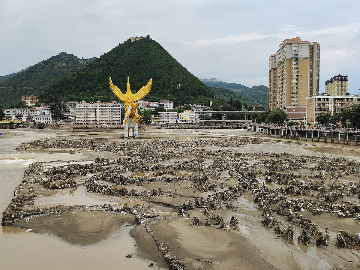 Sludge in the Jialing River after the flood receded in Fengxian County, Baoji City, Shaanxi Province, northwest China, July 21, 2024. /CFP