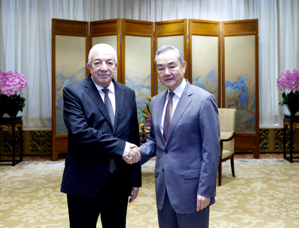 Chinese Foreign Minister Wang Yi shakes hands with Vice Chairman of the Central Committee of Fatah Mahmoud al-Aloul in Beijing, China, July 23, 2024. /Chinese Foreign Ministry