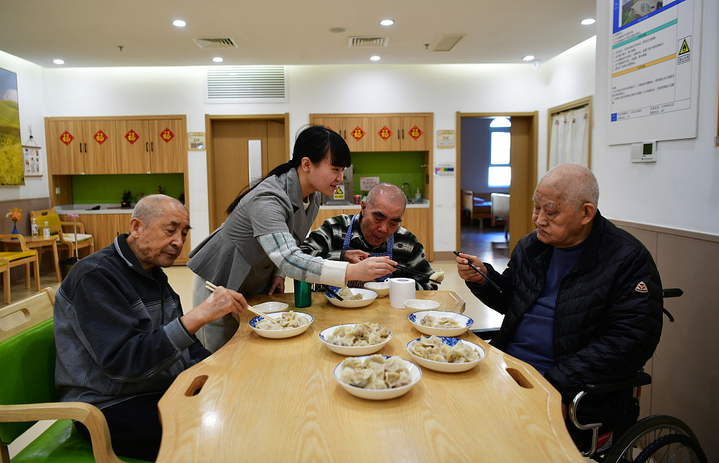Elderly people eat dumplings to celebrate the Dongzhi Festival at a nursing home in Shijiazhuang City, north China's Hebei Province, December 22, 2023. /CFP
