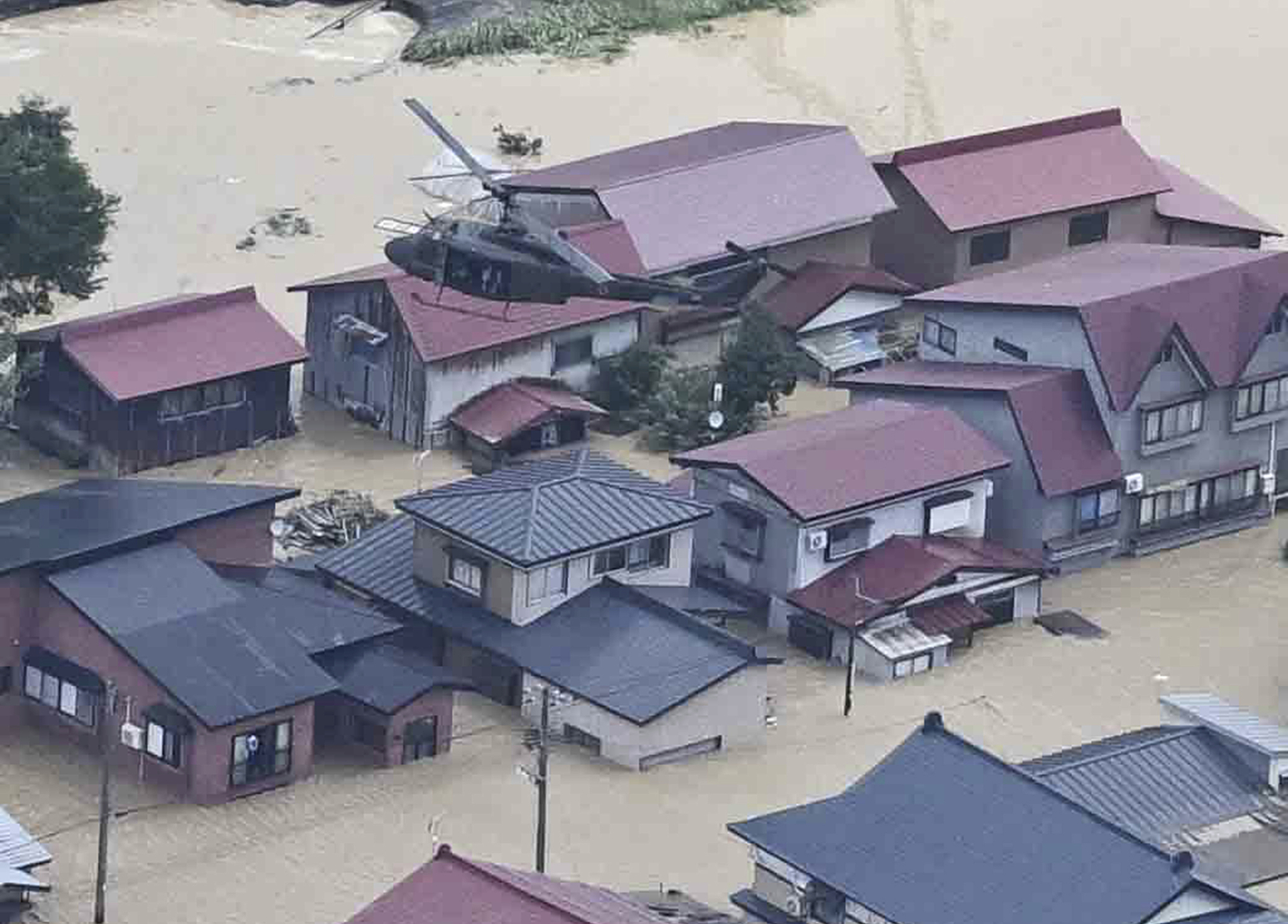 An aerial photo shows Japan's Self-defense Force conducting a rescue following torrential rain in Tozawa Village, Yamagata Prefecture, Japan, July 26, 2024. /CFP