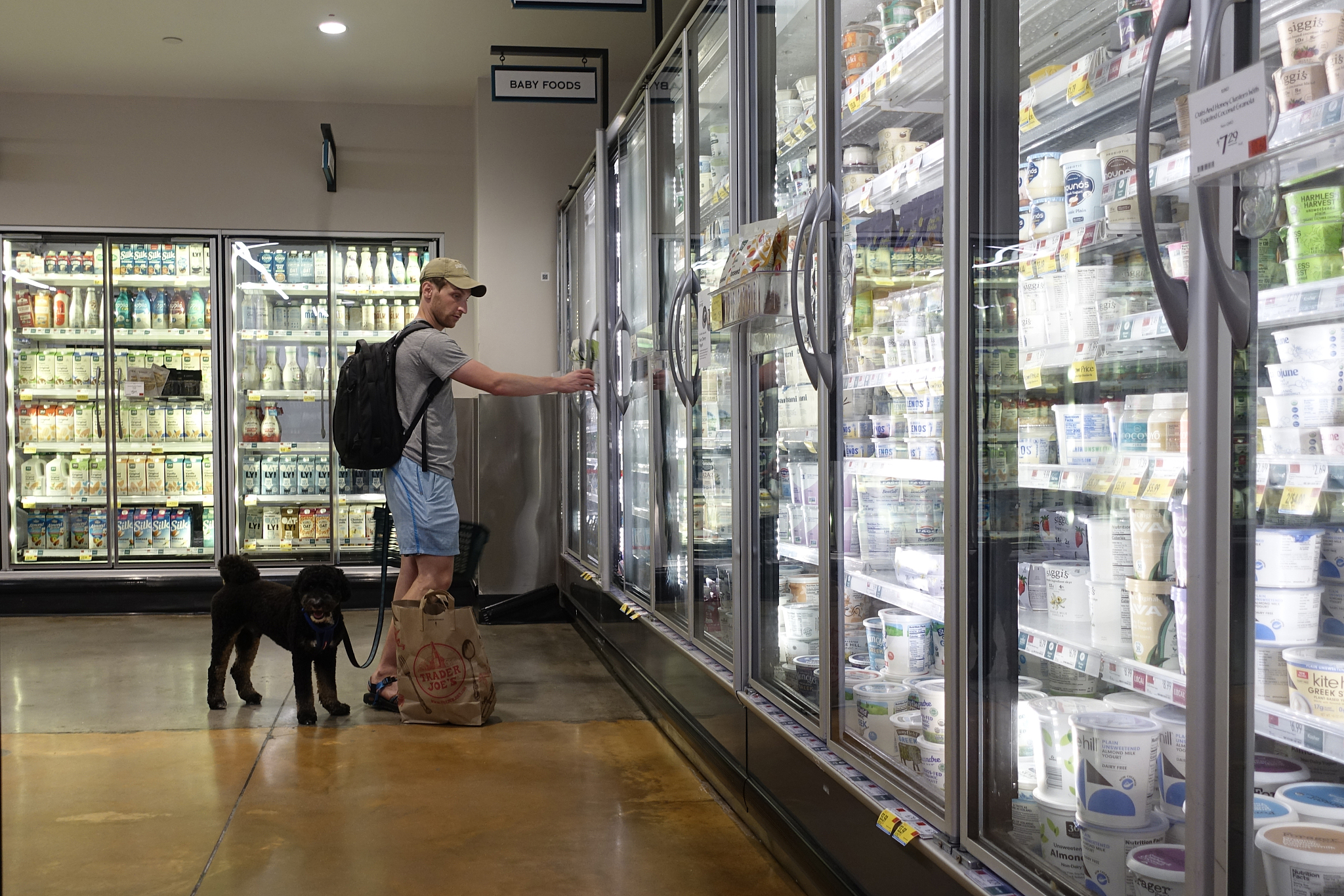 A customer is buying dairy products at a supermarket in Manhattan on July 11, 2024. /CFP