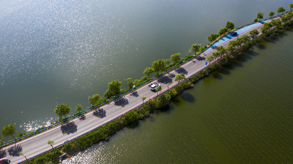 Rural roads appear to shuttle through blue skies and white clouds in Huaibei City, Anhui Province on July 25, 2024. /CFP