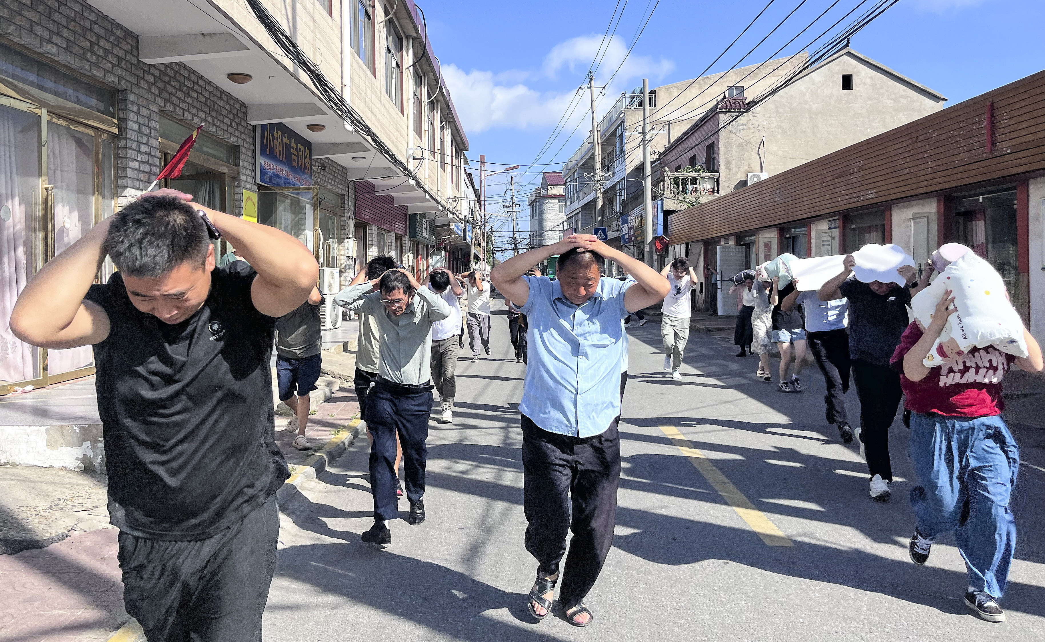 People participate in an earthquake drill in Gaojiayan Town, Huaiyin District, Huai'an City, Jiangsu Province, July 26, 2024. /CFP