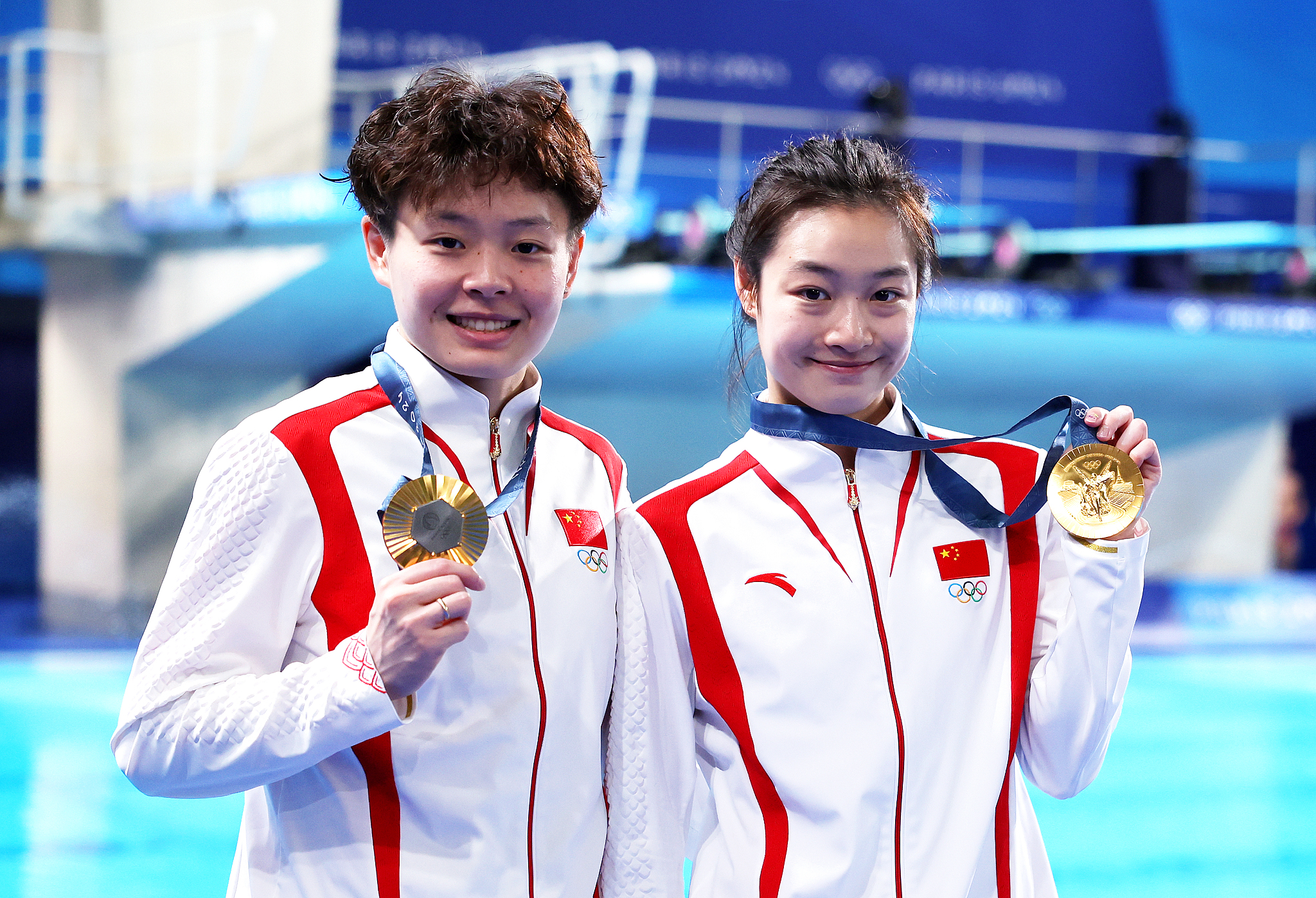 Chang Yani (R) and Chen Yiwen of China win the women's synchronized 3-meter springboard diving gold medal at the 2024 Summer Olympic Games in Paris, France, July 27, 2024. /CFP