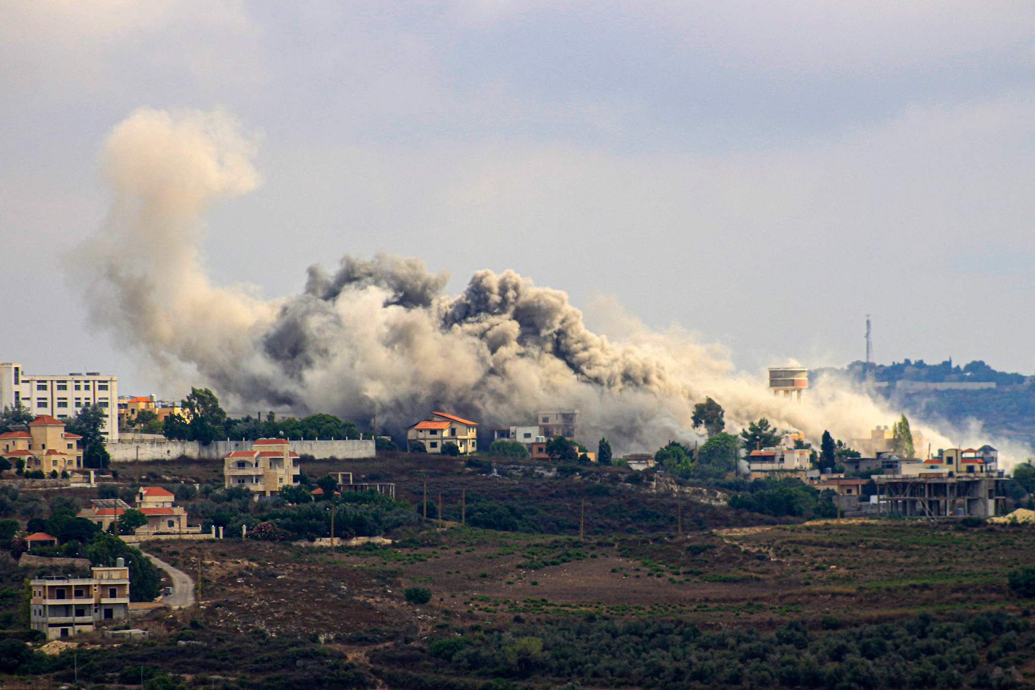 Smoke billows from a site targeted by Israeli shelling in the southern Lebanese border village of Tayr Harfa, amid ongoing cross-border clashes between Israeli troops and Hezbollah fighters, July 24, 2024. /CFP