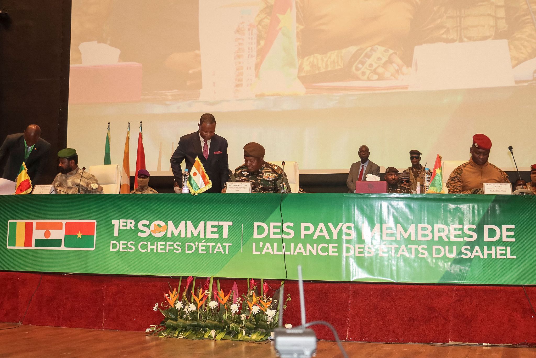 Mali's transitional President Assimi Goita (sitting, left), Niger's head of state, Abdourahmane Tchiani (center), and Burkina Faso's interim President Ibrahim Traore sign a treaty establishing the Alliance of the Sahel States in Niamey, Niger, on July 6, 2024. /CFP