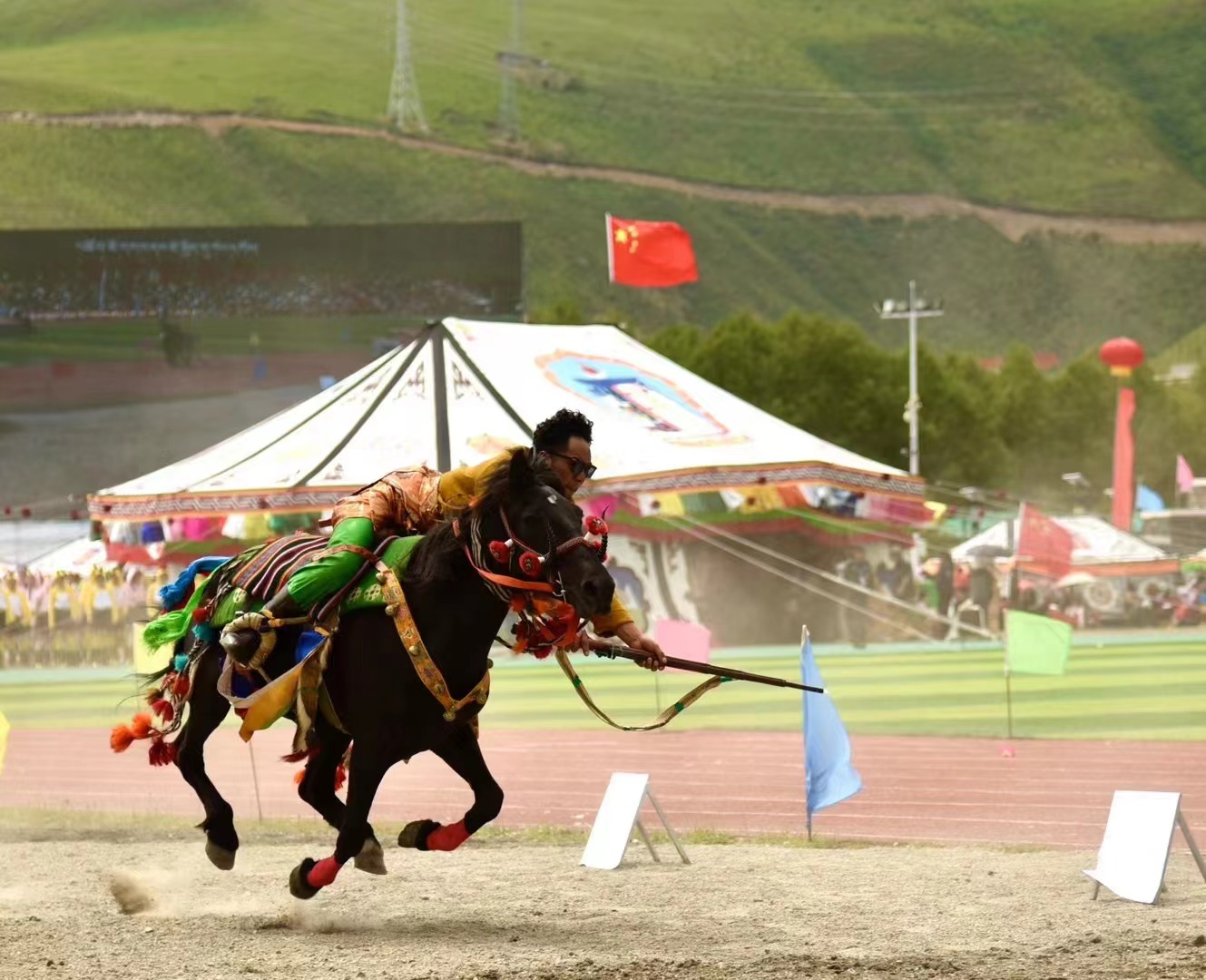 The opening of the Yushu Horse Racing Festival in Yushu City, Yushu Tibetan Autonomous Prefecture, northwest China's Qinghai Province, July 25, 2024. /Courtesy of Publicity Department of the CPC Yushu Municipal Committee