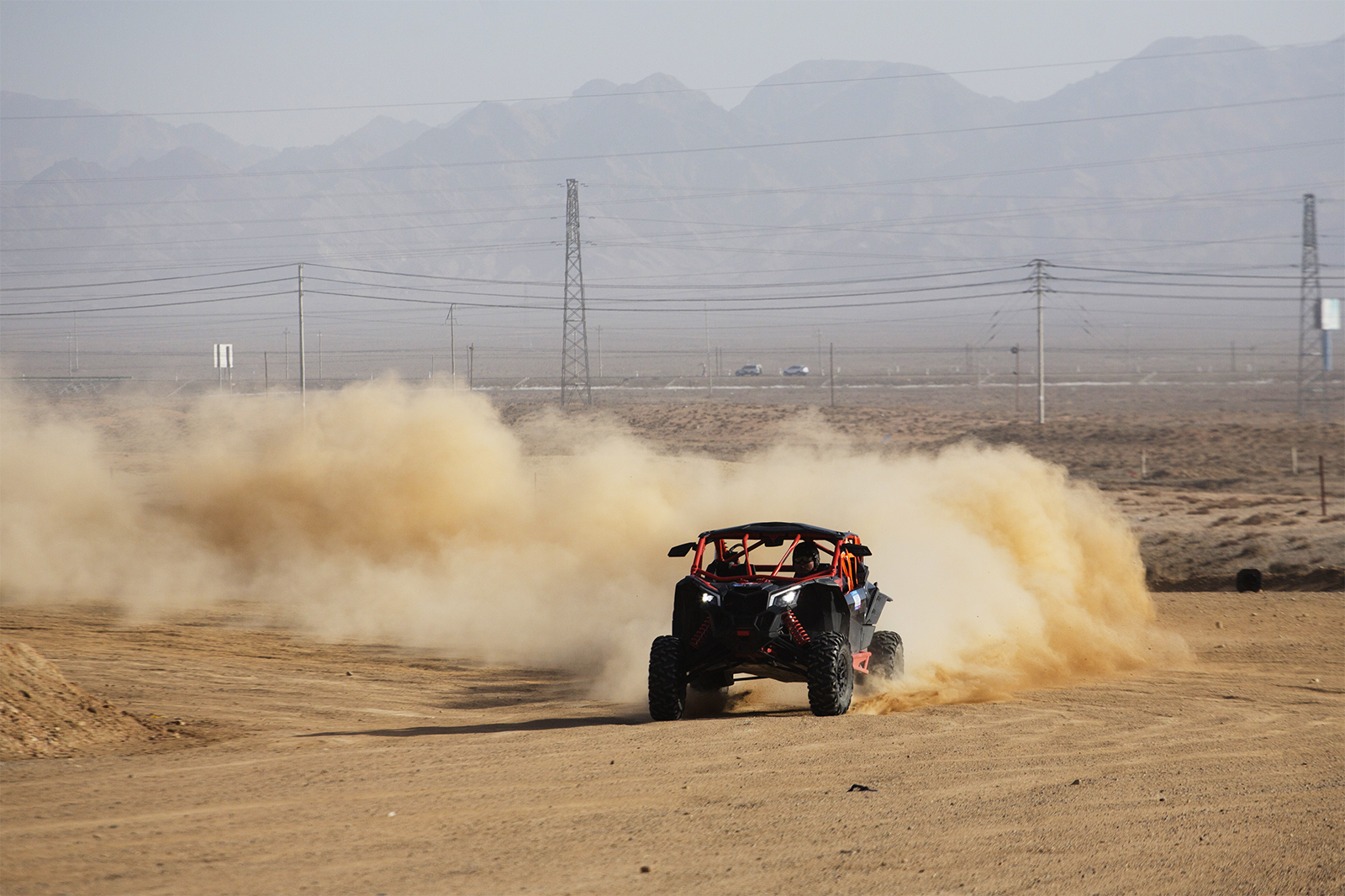 An off-road vehicle speeds through the Badain Jaran Desert in Alxa League, north China's Inner Mongolia Autonomous Region. /IC