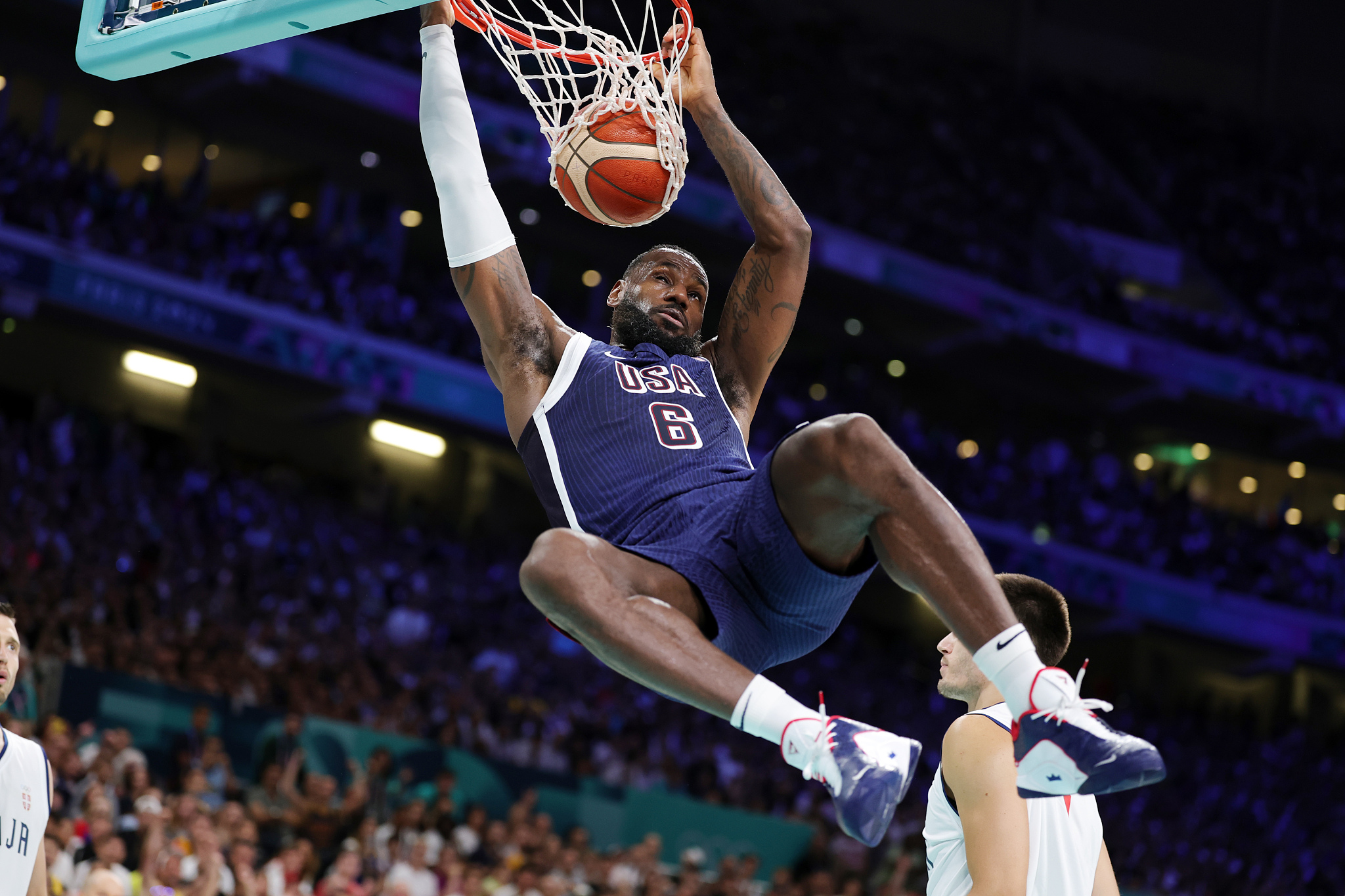 LeBron James (#6) of the USA dunks in a men's basketball game against Serbia at the 2024 Summer Olympics in Paris, France, July 28, 2024. /CFP