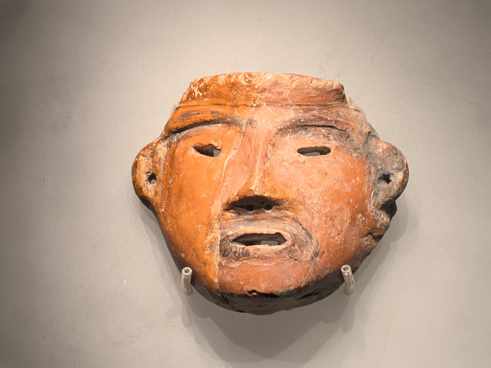 A ceramic human face from the collection of the Chinese Archaeological Museum in Beijing is pictured on July 28, 2024. /CFP