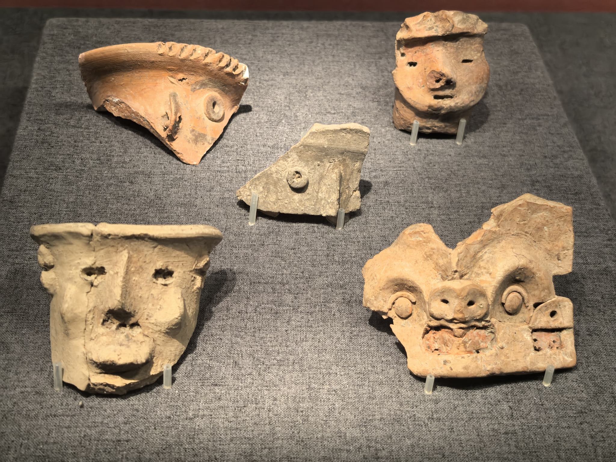 Ceramic faces from the collection of the Chinese Archaeological Museum in Beijing are pictured on July 28, 2024. /CFP