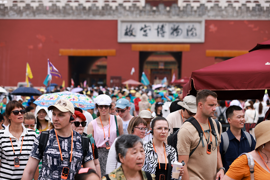 A photo taken in July, 2024 shows foreign tourists visiting the Palace Museum in Beijing. /CFP