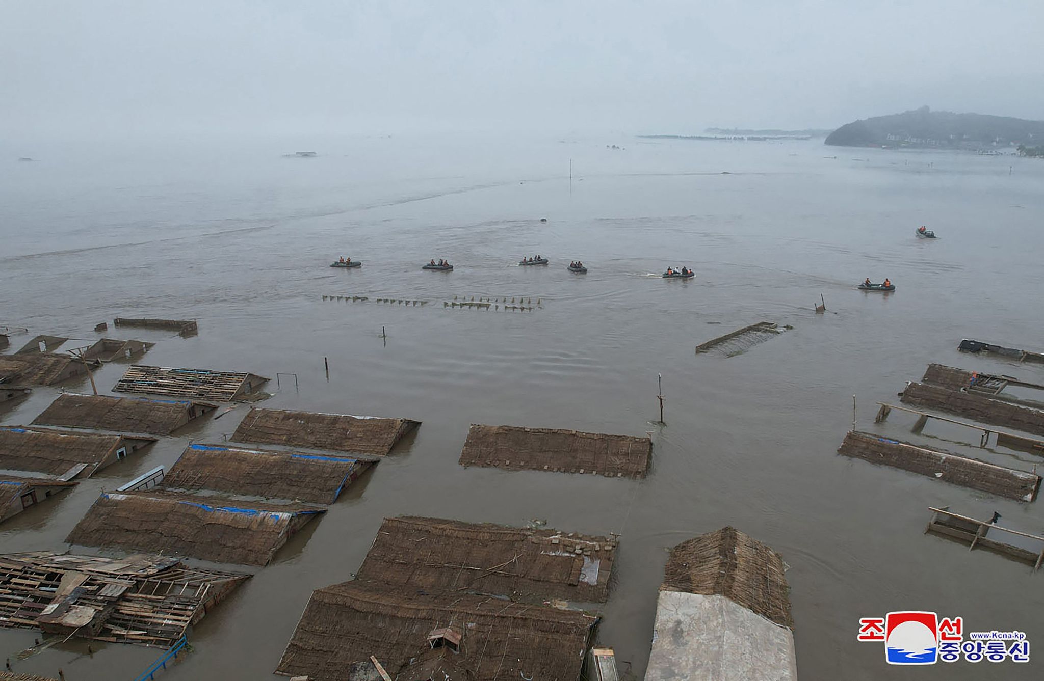 This recent undated photo released by the DPRK's official Korean Central News Agency (KCNA) via Korea News Service (KNS) on July 31, 2024 shows an aerial view of flooding after record-breaking heavy rains near the city of Sinuiju in North Pyongan Province. /AFP PHOTO/KCNA VIA KNS