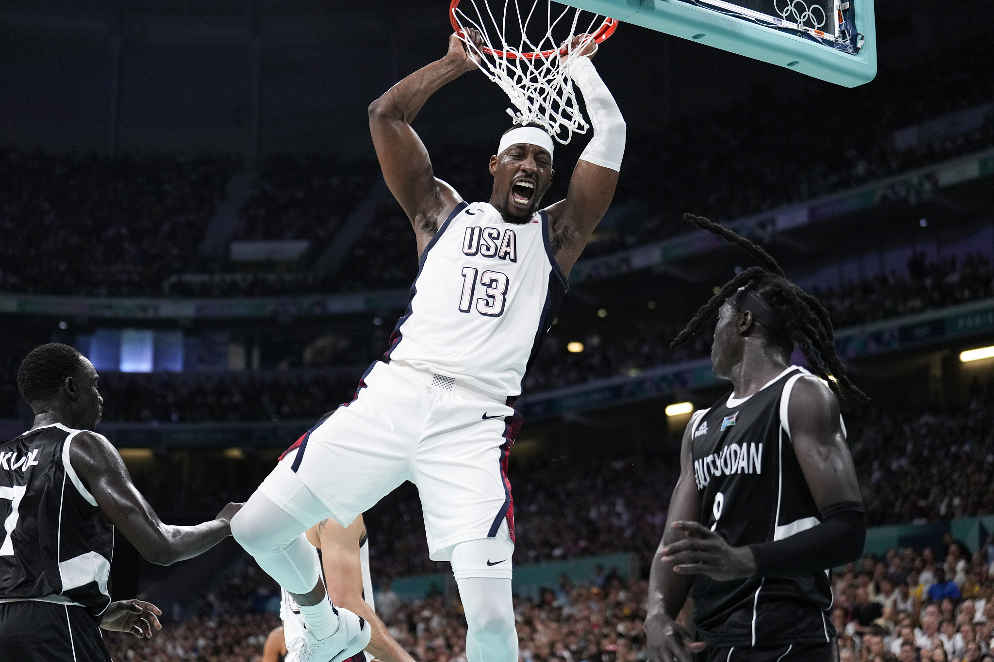 Bam Adebayo (#13) of the USA dunks in a men's basketball group stage game against South Sudan at the 2024 Summer Olympics in Paris, France, July 31, 2024. /CFP