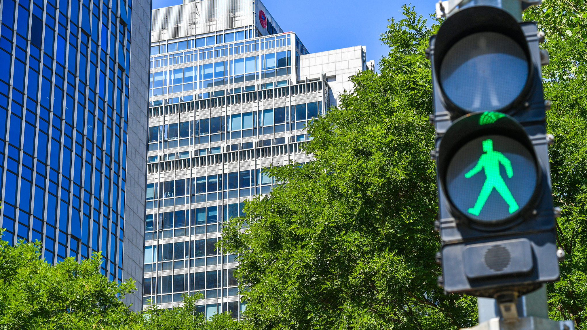 Residential and office buildings on a street of Beijing, China, May 30, 2024. /CFP