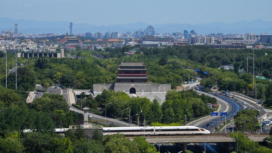 A bullet train runs past Yongdingmen Gate in Beijing, capital of China, July 18, 2024. /Xinhua