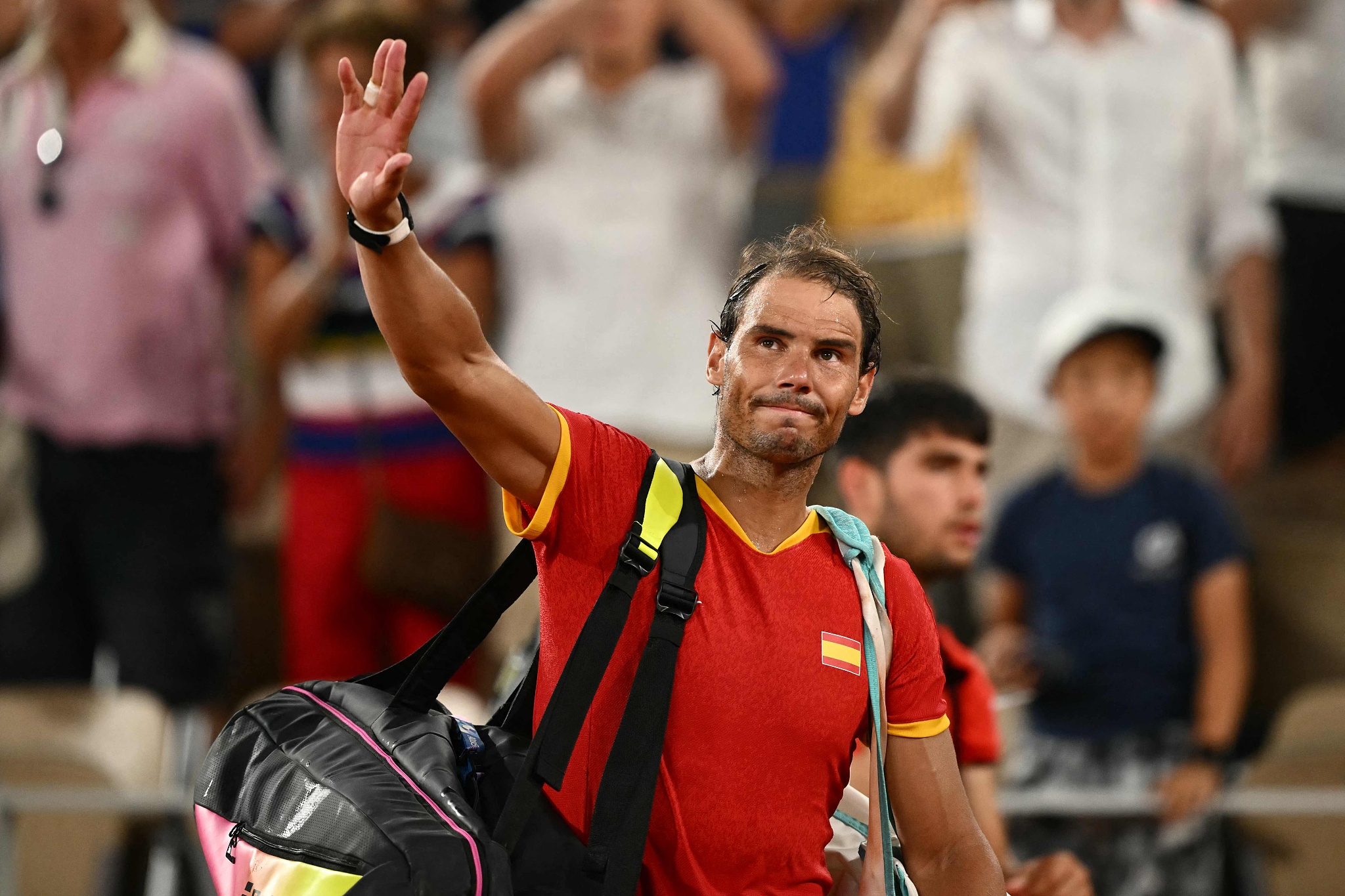 Rafael Nadal of Spain waves goodbye to the spectators after he and Carlos Alcaraz lose to Austin Krajicek and Rajeev Ram of the USA in the men's doubles tennis quarterfinals at the 2024 Summer Olympics in Paris, France, July 31, 2024. /CFP