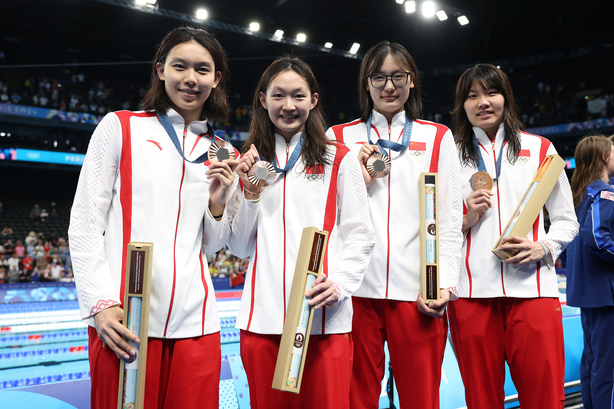 L-R: China's Yang Junxuan, Li Bingjie, Ge Chutong and Liu Yaxin celebrate after taking bronze in the women's 4×200m freestyle relay final during the Summer Olympics in Paris, France, August 1, 2024. /CFP 