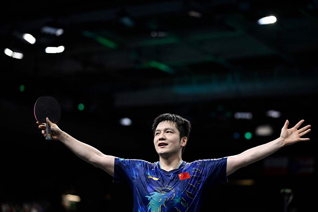 Fan Zhendong of China celebrates his victory over Tomokazu Harimoto of Japan (not pictured) after their men's singles table tennis quarterfinal match at the Summer Olympics in Paris, France, August 1, 2024. /CFP