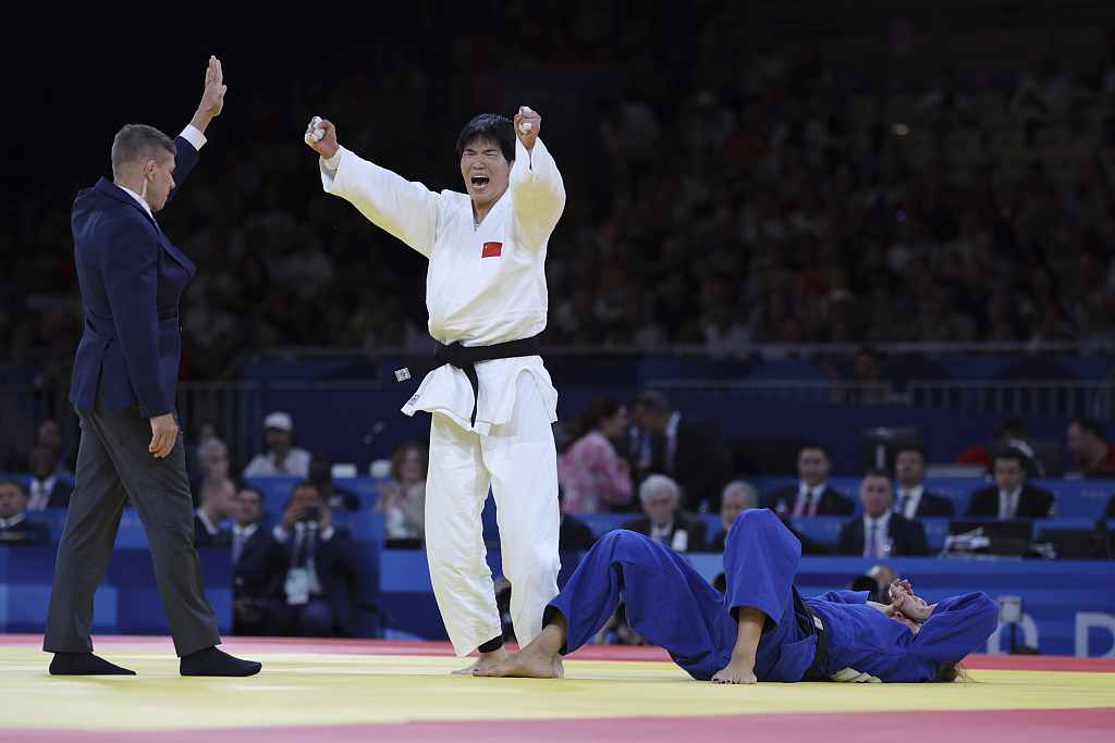 Ma Zhenzhao (C) of China reacts after defeating Anna-Maria Wagner (R) of Germany during their women's judo -78kg bronze-medal match at the Summer Olympics in Paris, France, August 1, 2024. /CFP