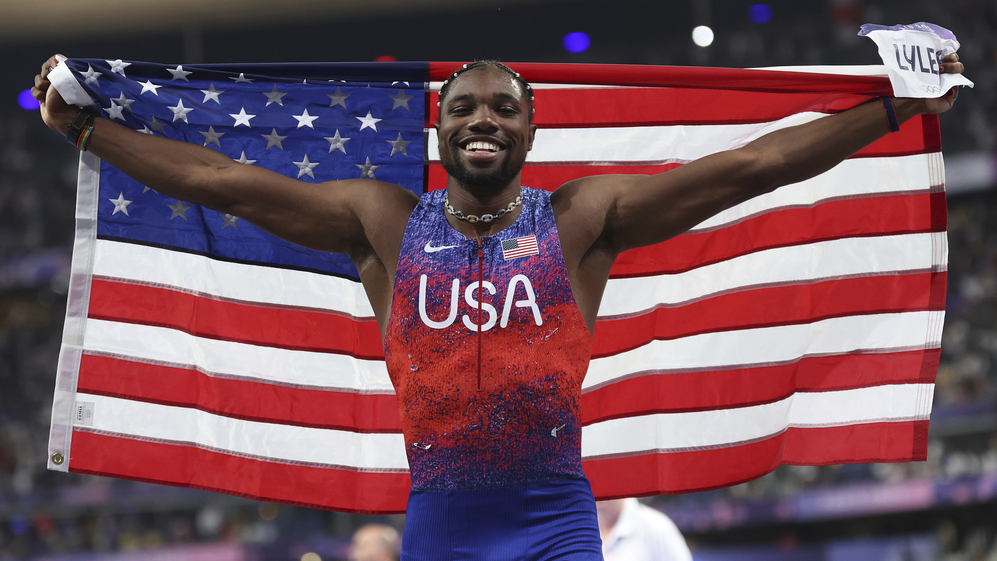 Noah Lyles of the USA celebrates after winning the men's 100 meter athletics final at the 2024 Paris Summer Olympics at the Stade de France in Saint-Denis, France, August 4, 2024. /CFP