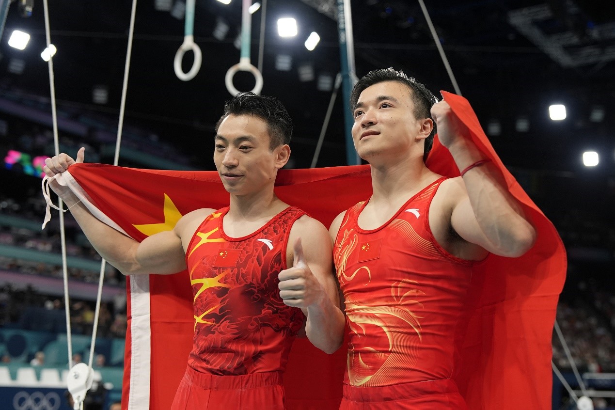 China's Liu Yang (R) and Zou Jingyuan celebrates after winning gold and silver, respectively, in the men's rings artistic gymnastics final at the 2024 Summer Olympics at the Bercy Arena in Paris, France, August 4, 2024. /CFP