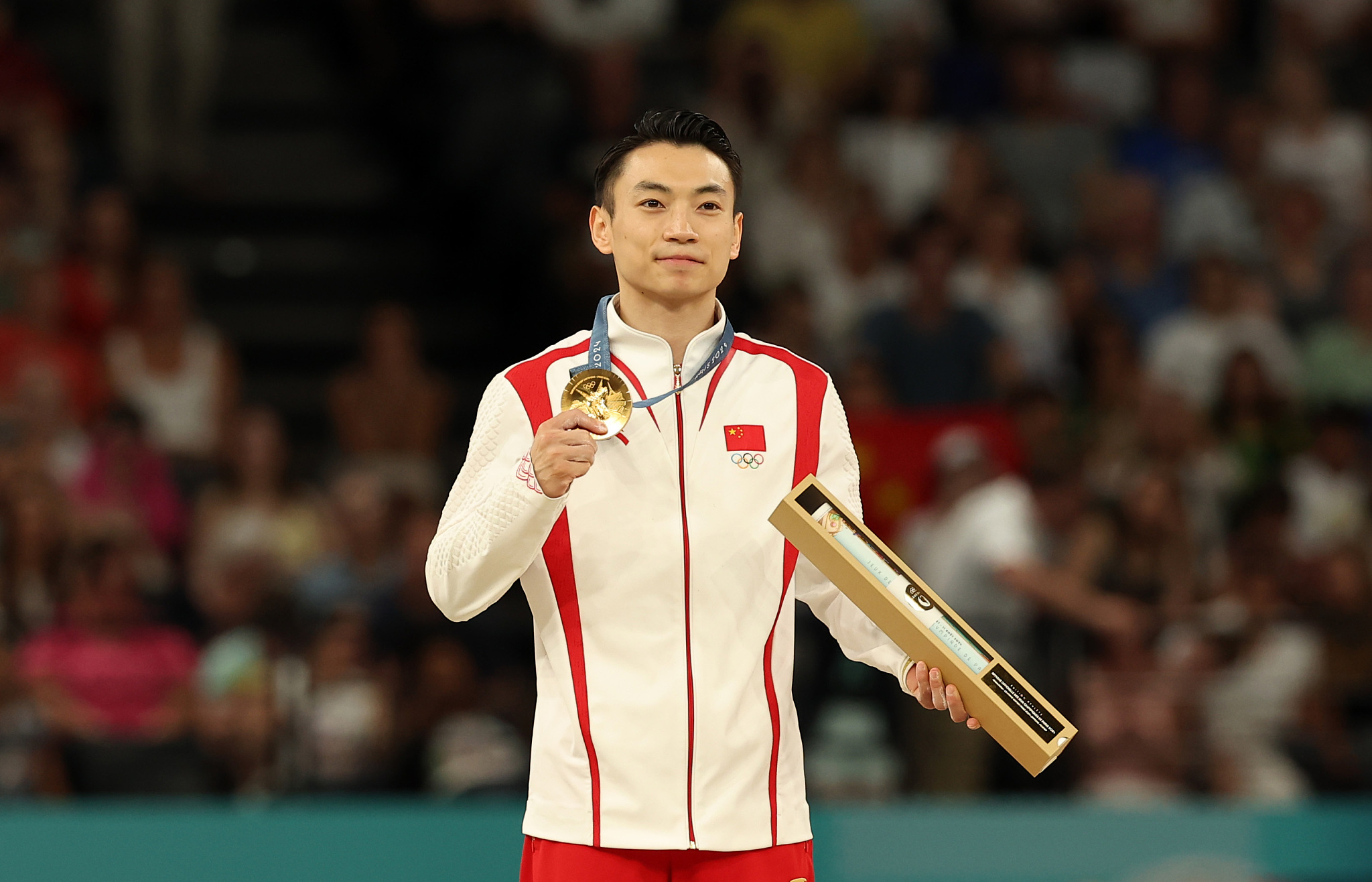 Zou Jingyuan of China wins the artistic gymnastics men's parallel bars gold medal at the 2024 Summer Olympic Games in Paris, France, August 5, 2024. /CFP