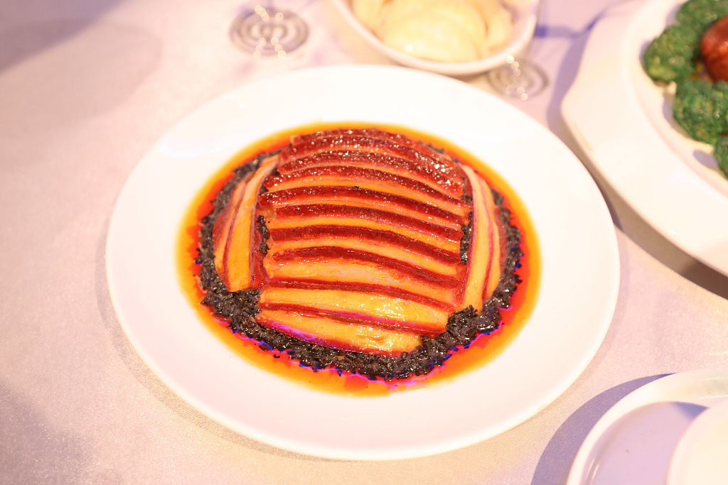 A braised pork belly with pickled vegetable dish is on display at an exhibition at the National Museum of China in Beijing on August 6, 2024. /CFP