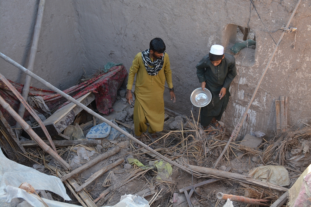 Afghan citizens observe the destroyed area after a flood that left nearly 350 injured and at least 40 people dead in Nangarhar Province, Afghanistan, July 16, 2024. /CFP