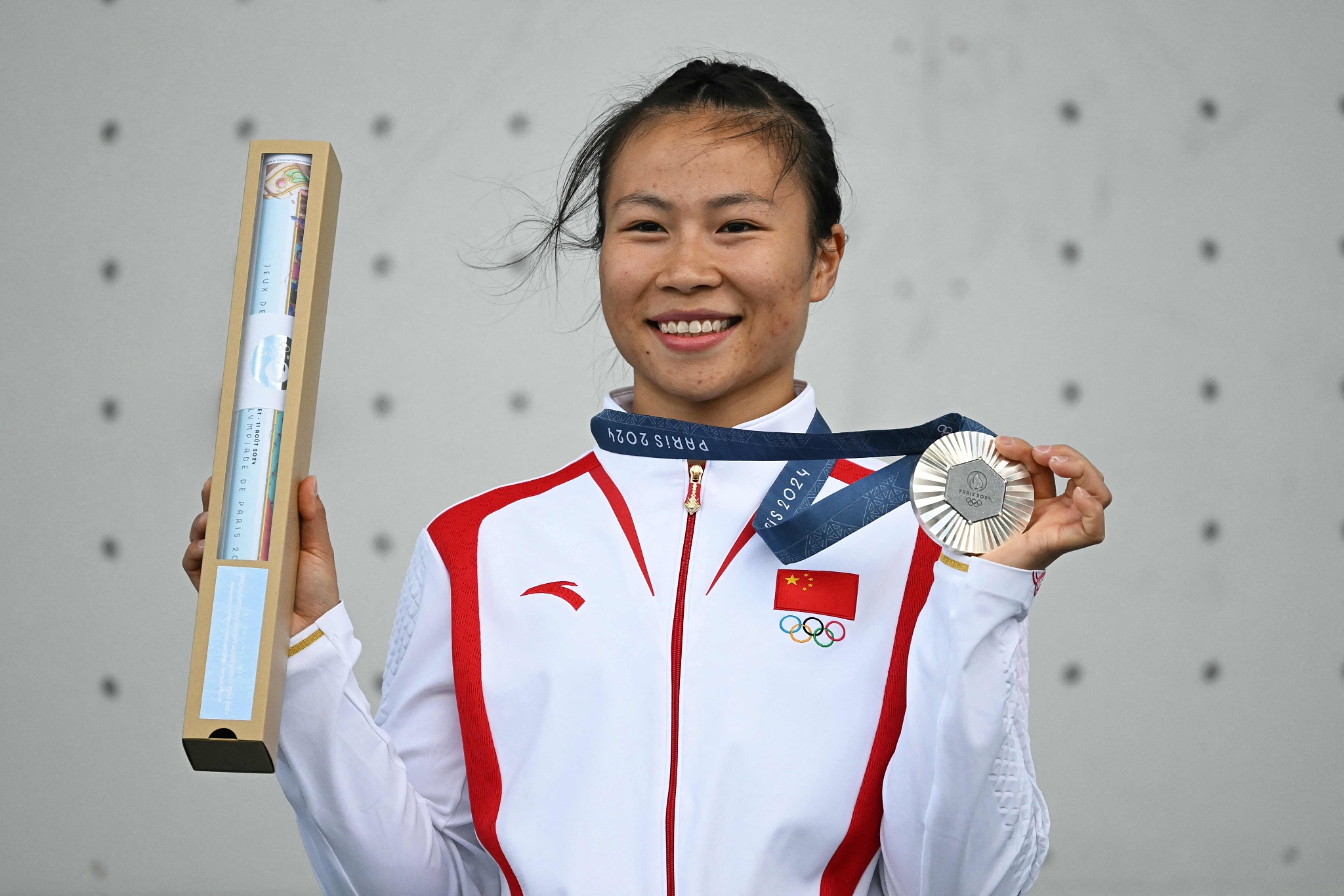 Deng Lijuan of China celebrates after securing the sport climbing women's speed silver medal at the 2024 Summer Olympics in Paris, France, August 7, 2024. /CFP