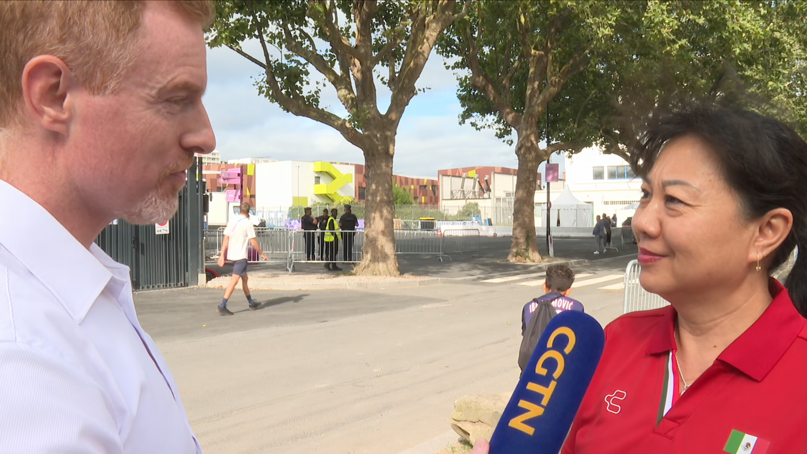 Ma Jin (R), coach of the Mexican diving team, speaks to CGTN Sports Scene's Greg Laffradi during the 2024 Summer Olympics in Paris, France. /CGTN