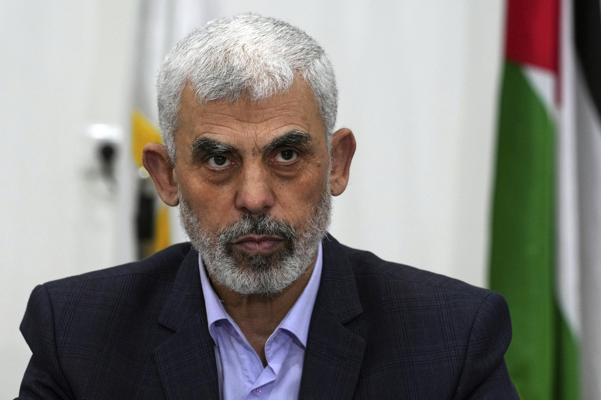 A file photo of Yahya Sinwar chairing a meeting with leaders of Palestinian factions at his office in Gaza City, April 13, 2022. Hamas announced on Tuesday the selection of Yahya Sinwar as its political bureau chief. /CFP