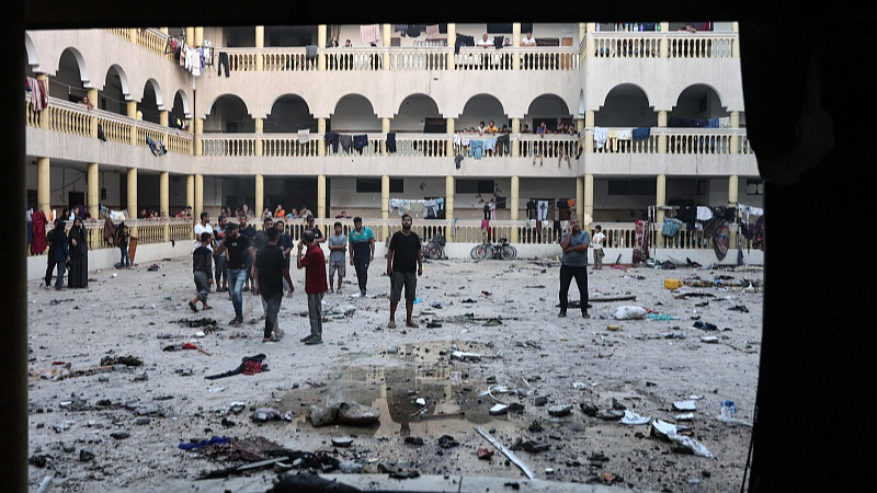 Displaced Palestinians gather in the yard of a school hit by an Israeli strike in Gaza City, August 10, 2024. /CFP