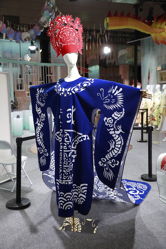 A traditional Chinese costume made of paper is on display at the 2024 Xi'an Silk Road International Tourism Expo in Xi'an City, Shaanxi Province, August 10, 2024. /CFP