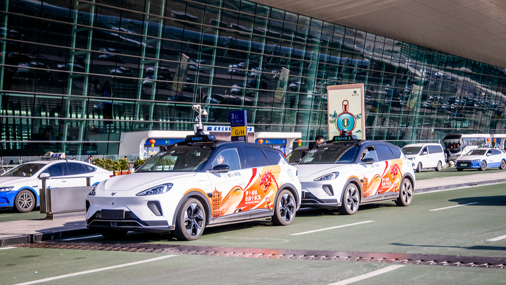 A group of robottaxis drive in Wuhan Tianhe Airport, Wuhan City, central China's Hubei Province, January 24, 2024. /CFP