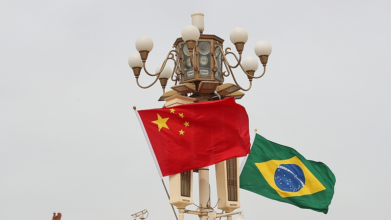 A file photo of the national flags of China and Brazil. /CFP